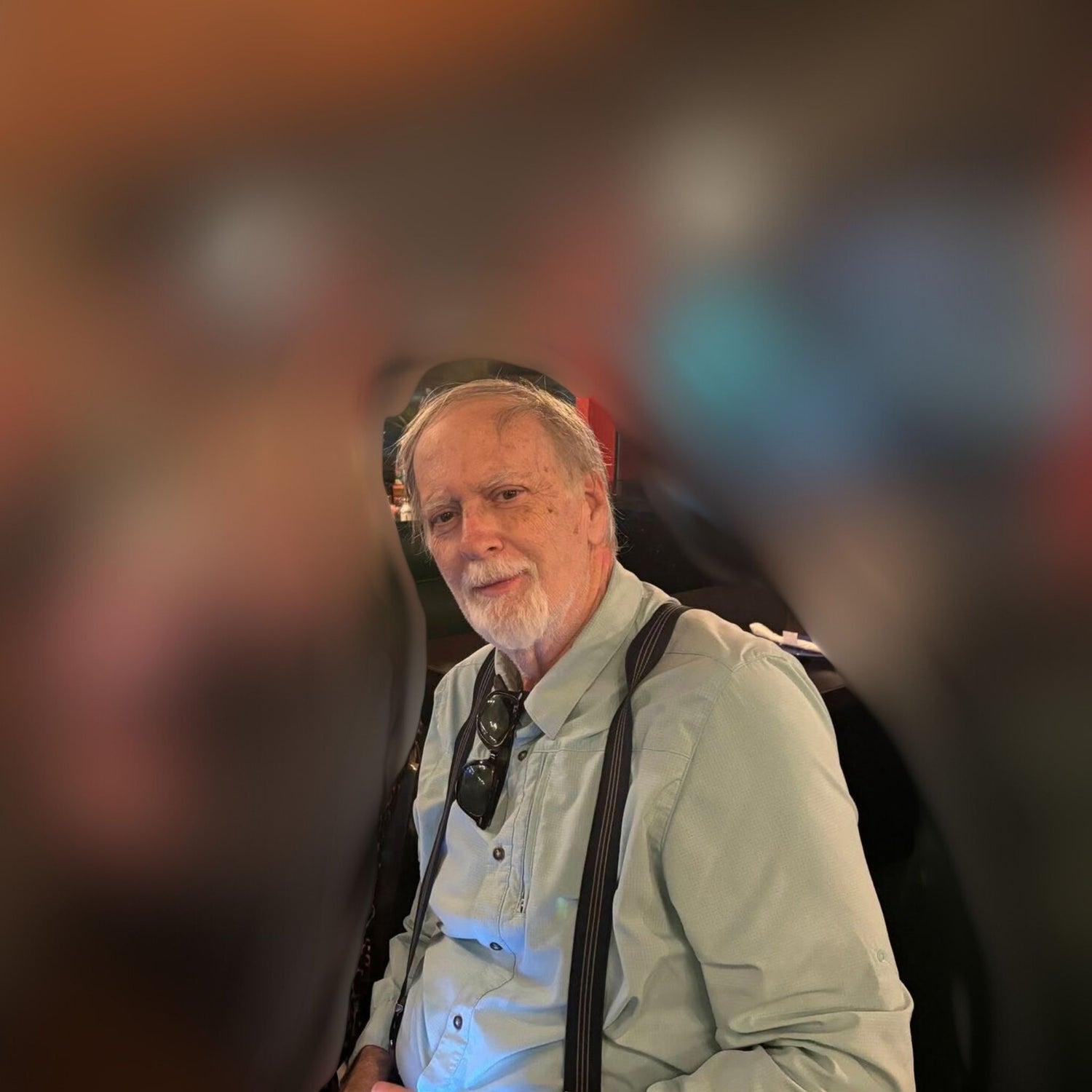 Portrait of a man in a softly blurred indoor setting, reflecting the experience and care behind AtoZ Botanicals.